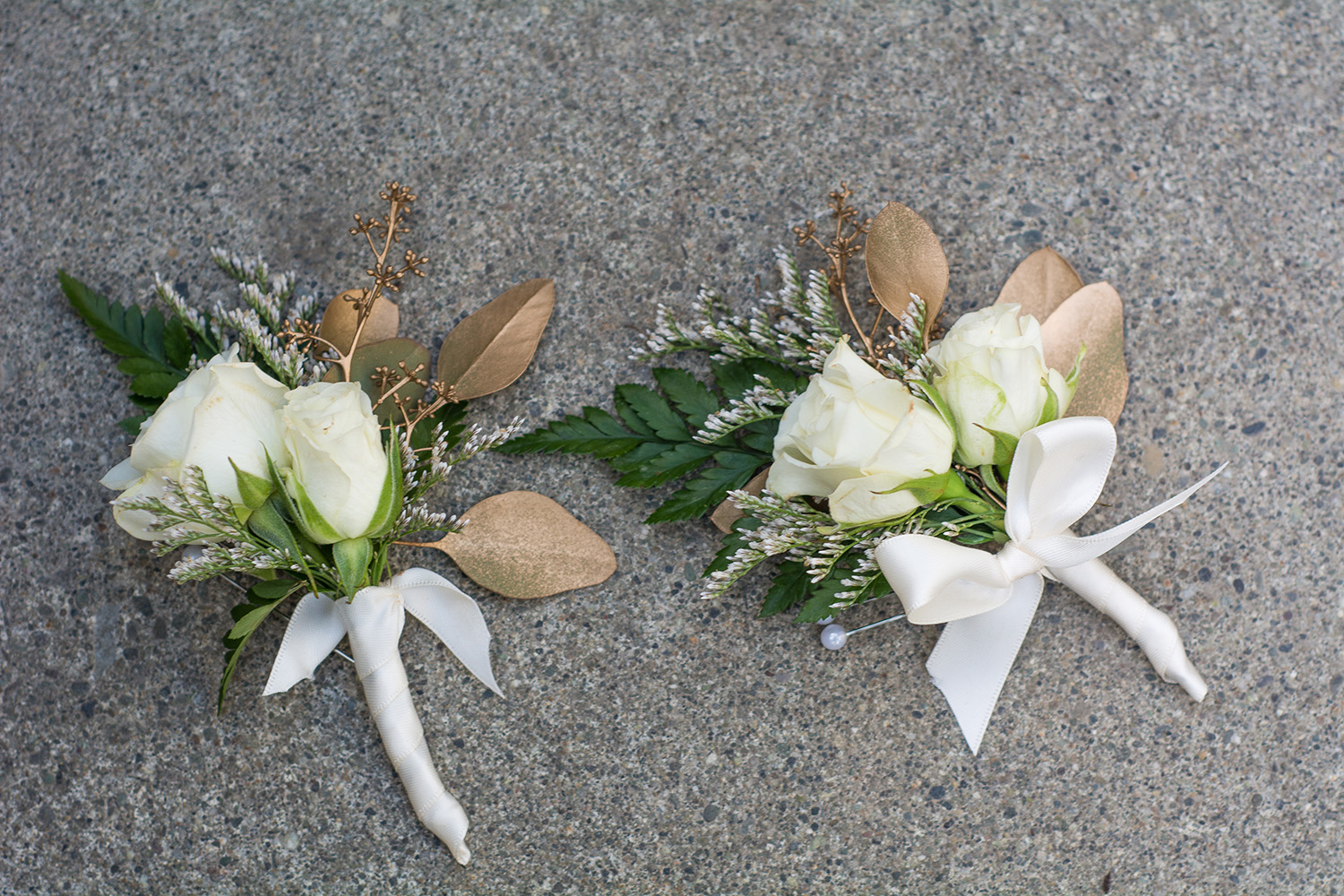 White and gold boutonnieres designed by Natasha Price of Paper Peony Alaska | Photo by Sean Carpenter