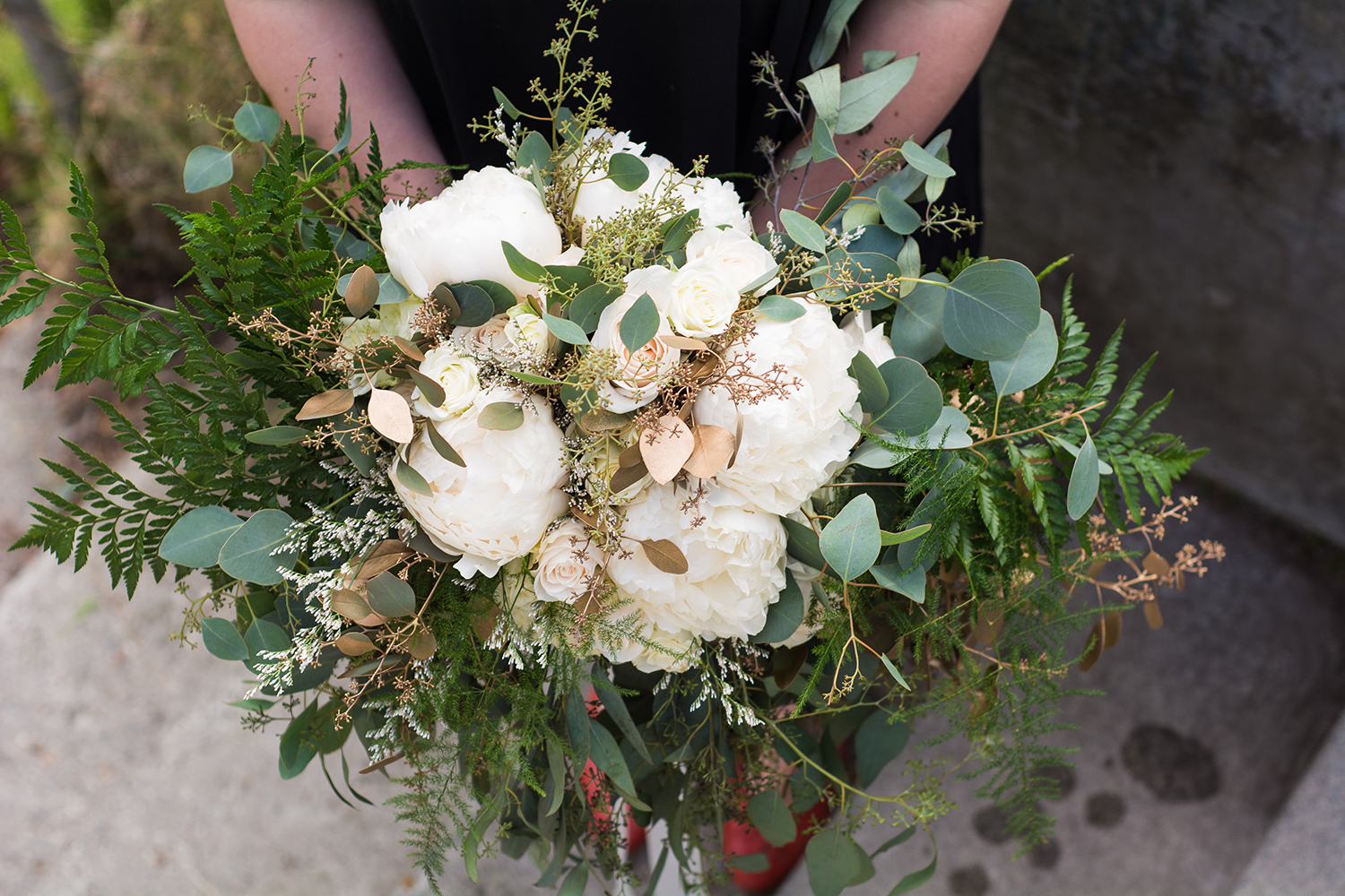 Bridal bouquet with white peonies and eucalyptus | designed by Natasha Price and photo by Sean Carpenter