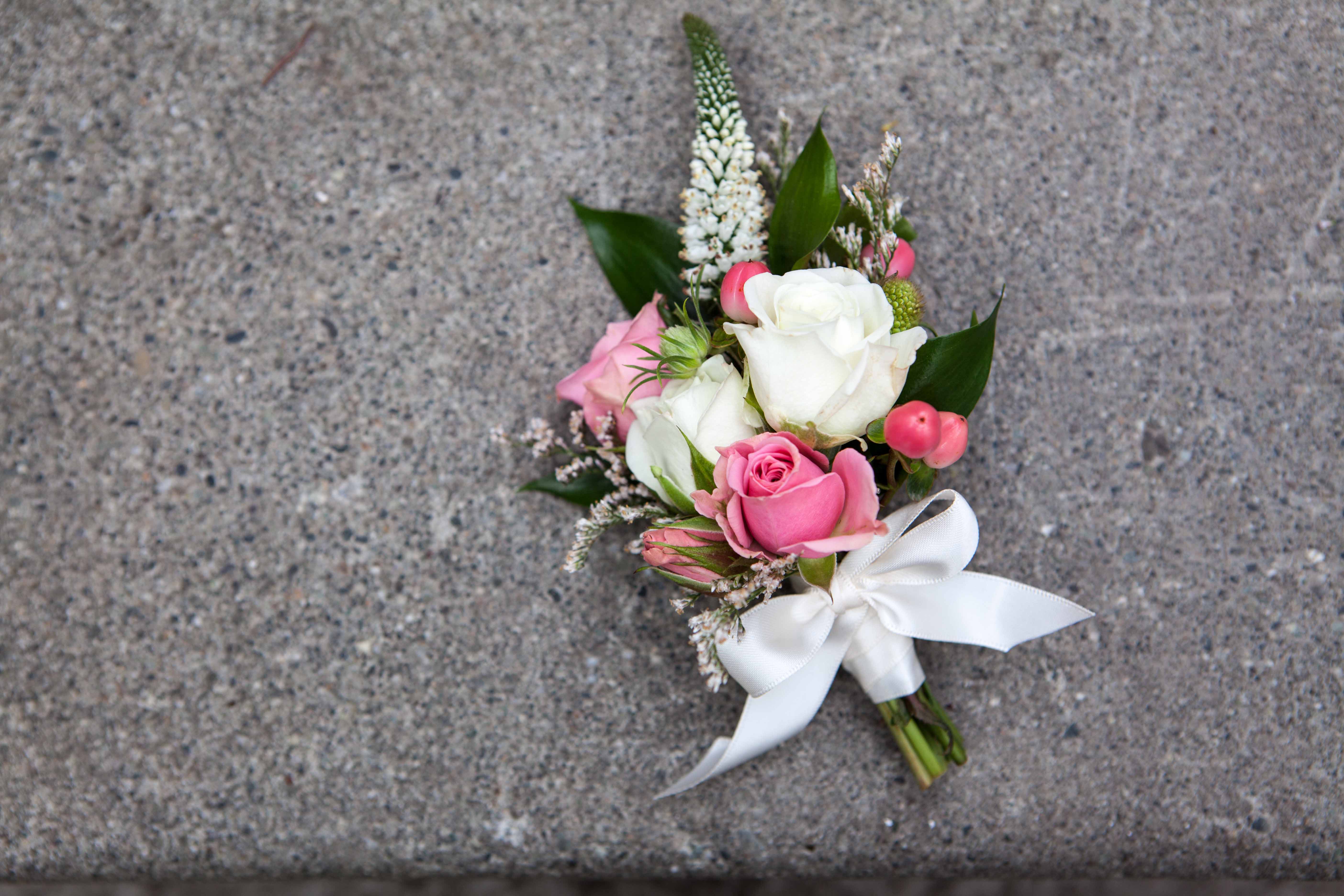 Cosage with pink and white spray roses, veronica and hypericum berry | designed by Natasha Price of Paper Peony Alaska